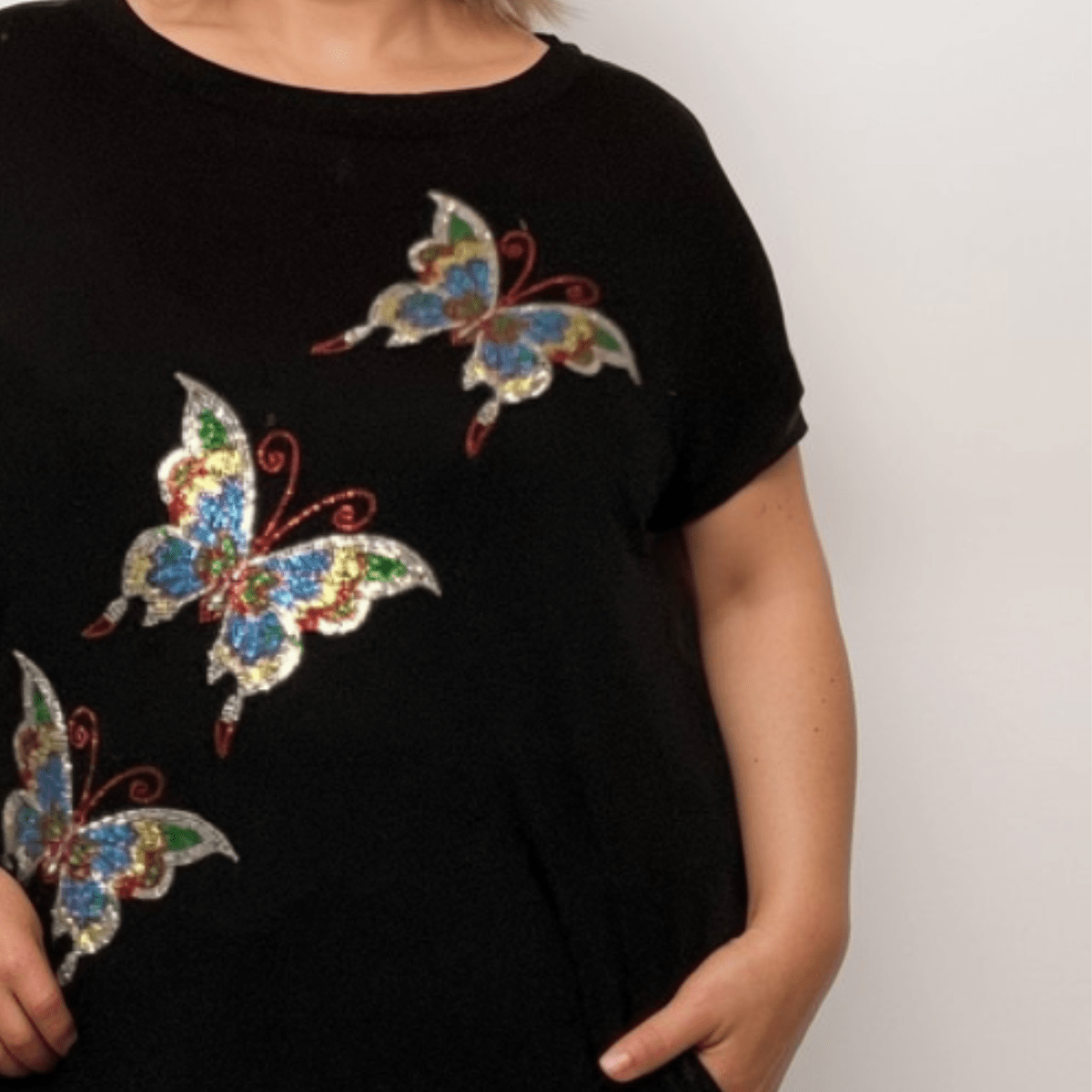 Sequin Butterfly Dipped Hem Top with Pockets